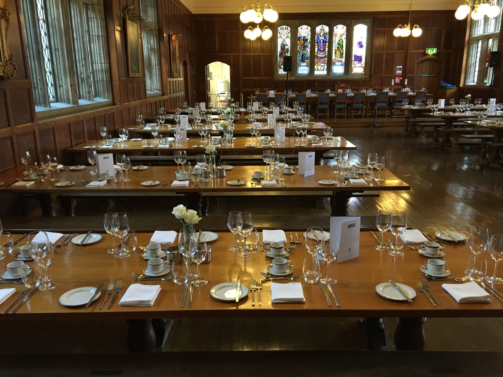 This is an image of part of the main dining hall in St Salvator's Hall. It has been set for a formal event.